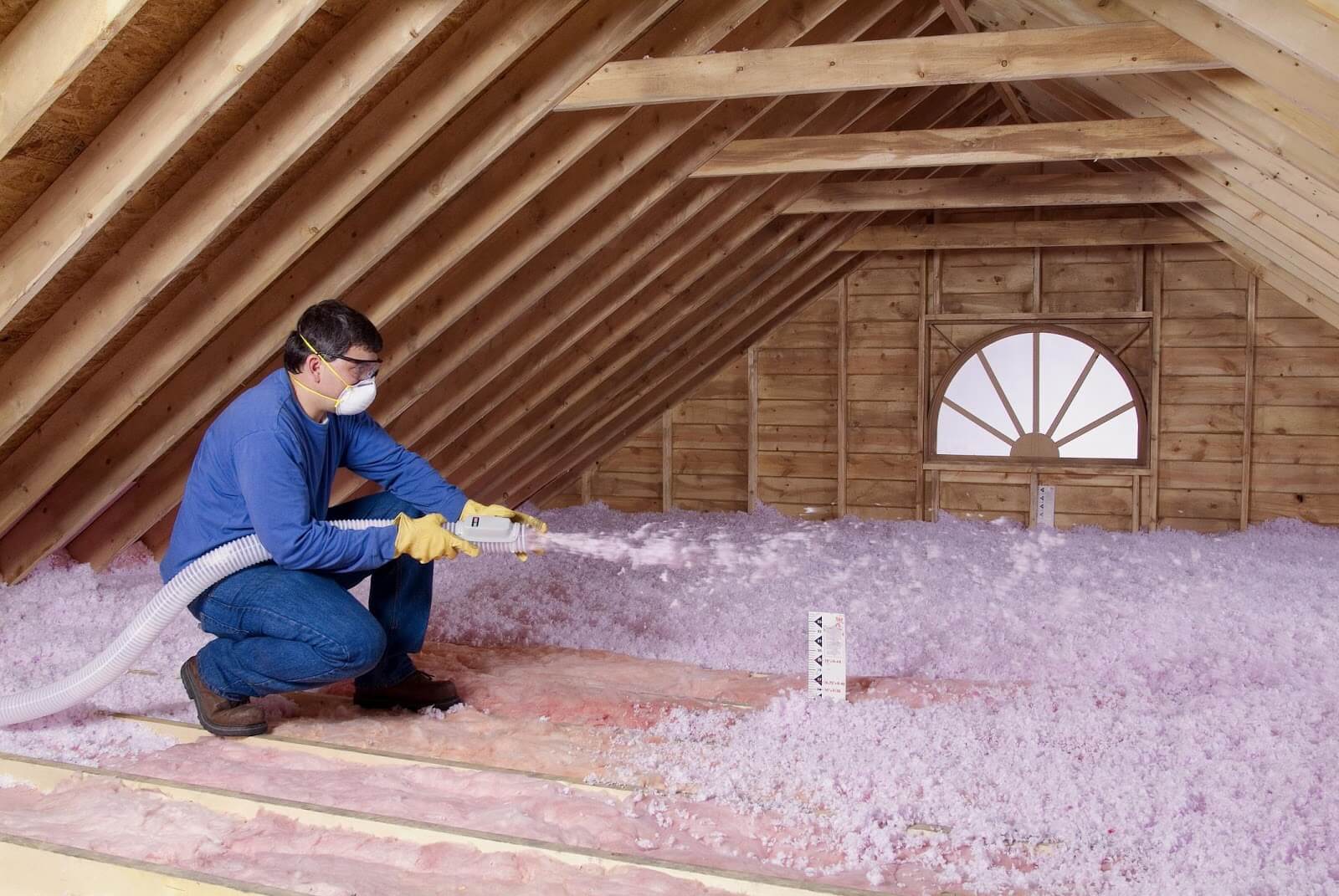 Man applying insulation